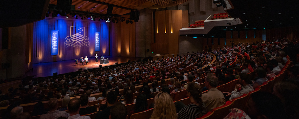 The seats of Llewellyn Hall with a full audience watching ANU Chancellor Julie Bishop speak on stage.