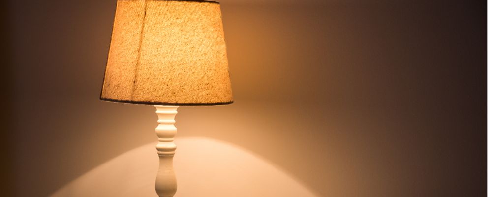 A picture of a canvas lamp beaming warm light.