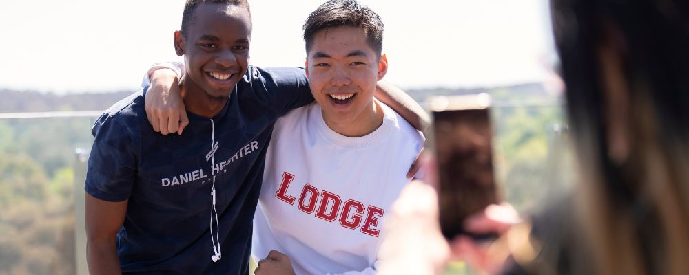 Two male ANU students on a residential rooftop on the ANU campus.