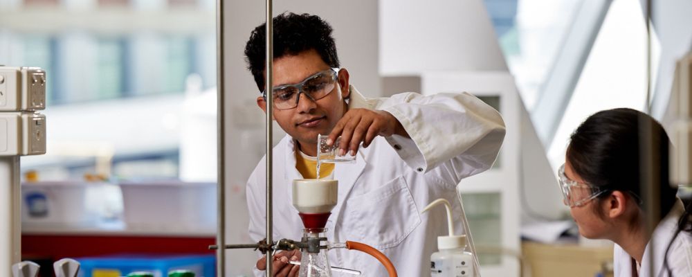 Medical students at the Australian National University in a lab working together.