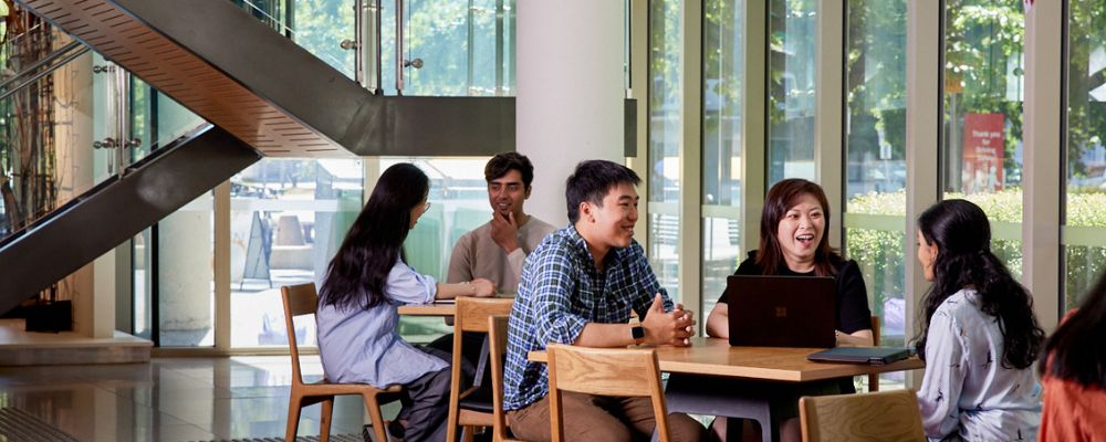 ANU students study together and collaborate on campus inside an ANU building.