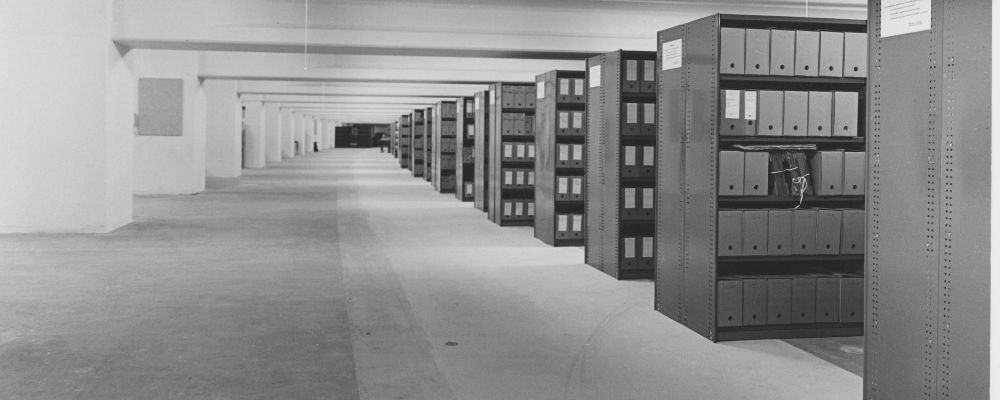 The rows of storage shelving underground in the repository space of the ANU Archives