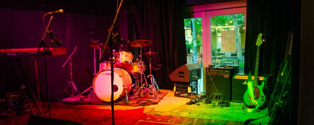 A front-on view of the stage set up in Dissent Café and Bar in Canberra.
