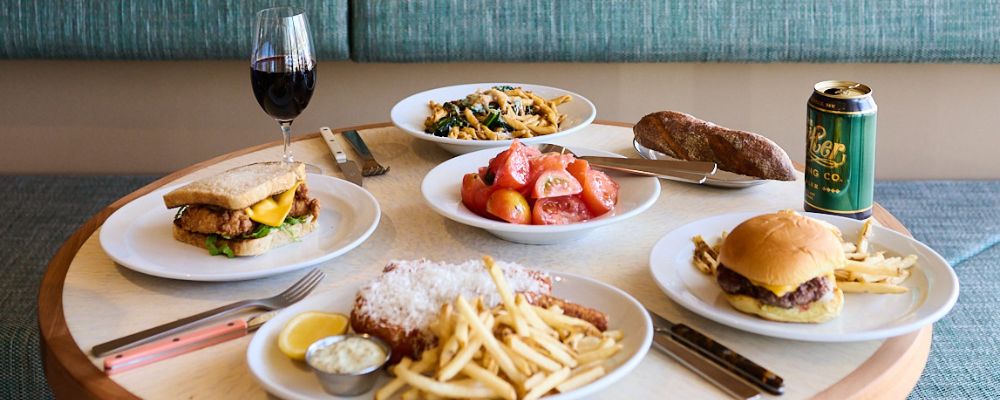 A table at Recess Coffee with different menu offerings available across the breakfast and lunch menus.